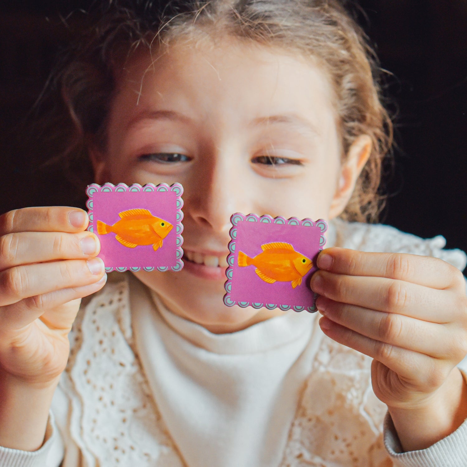 Child with two matching tiles