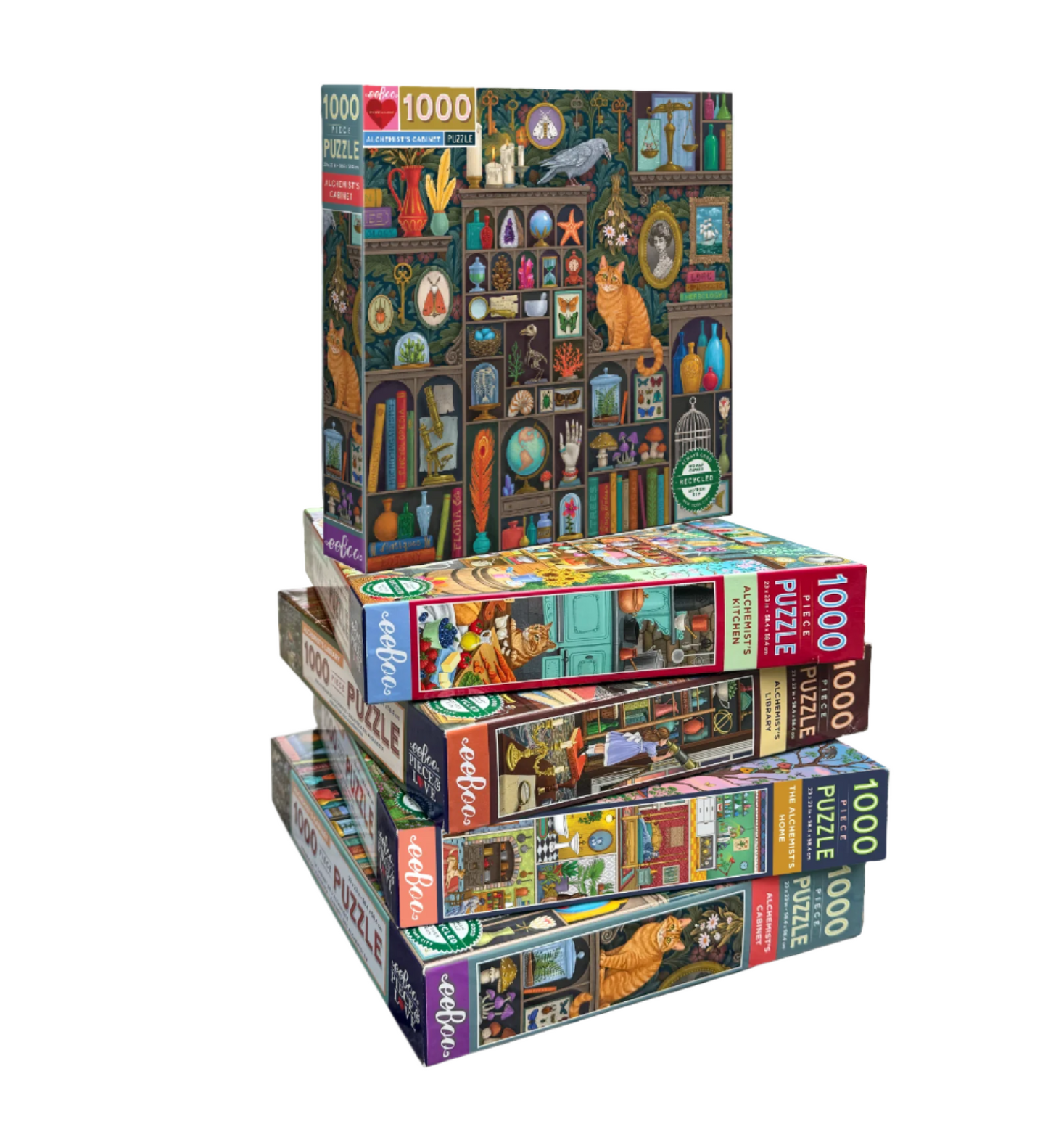 Stack of colorful puzzle boxes with cat-themed artwork on a white background