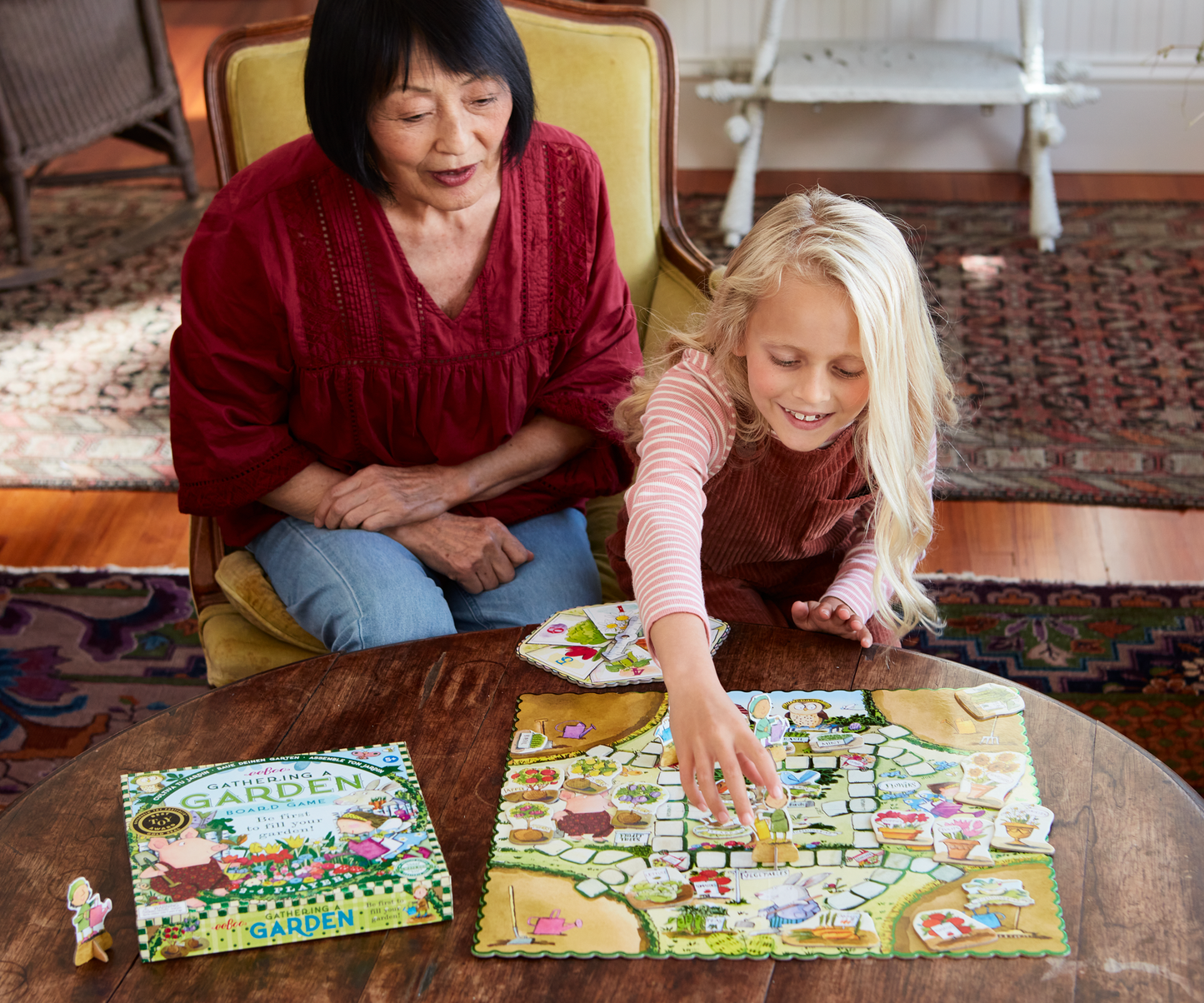 Child & adult playing gathering a garden game