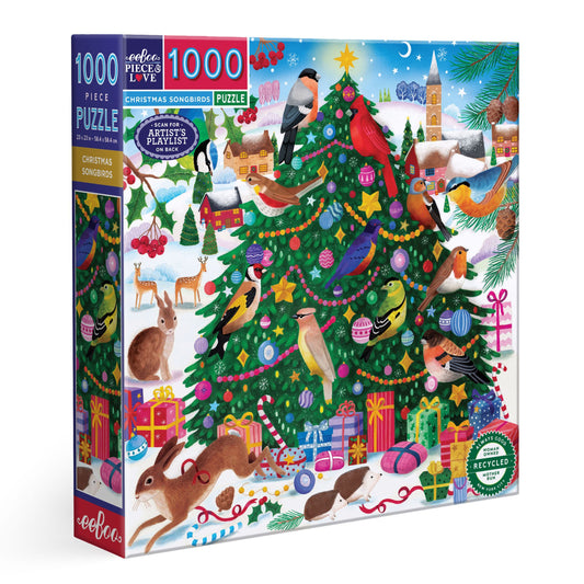 Jigsaw puzzle box with a Christmas-themed design featuring a decorated tree, animals, and presents. Christmas Songbirds 1000 Piece Puzzle by eeBoo | Unique Beautiful Gifts