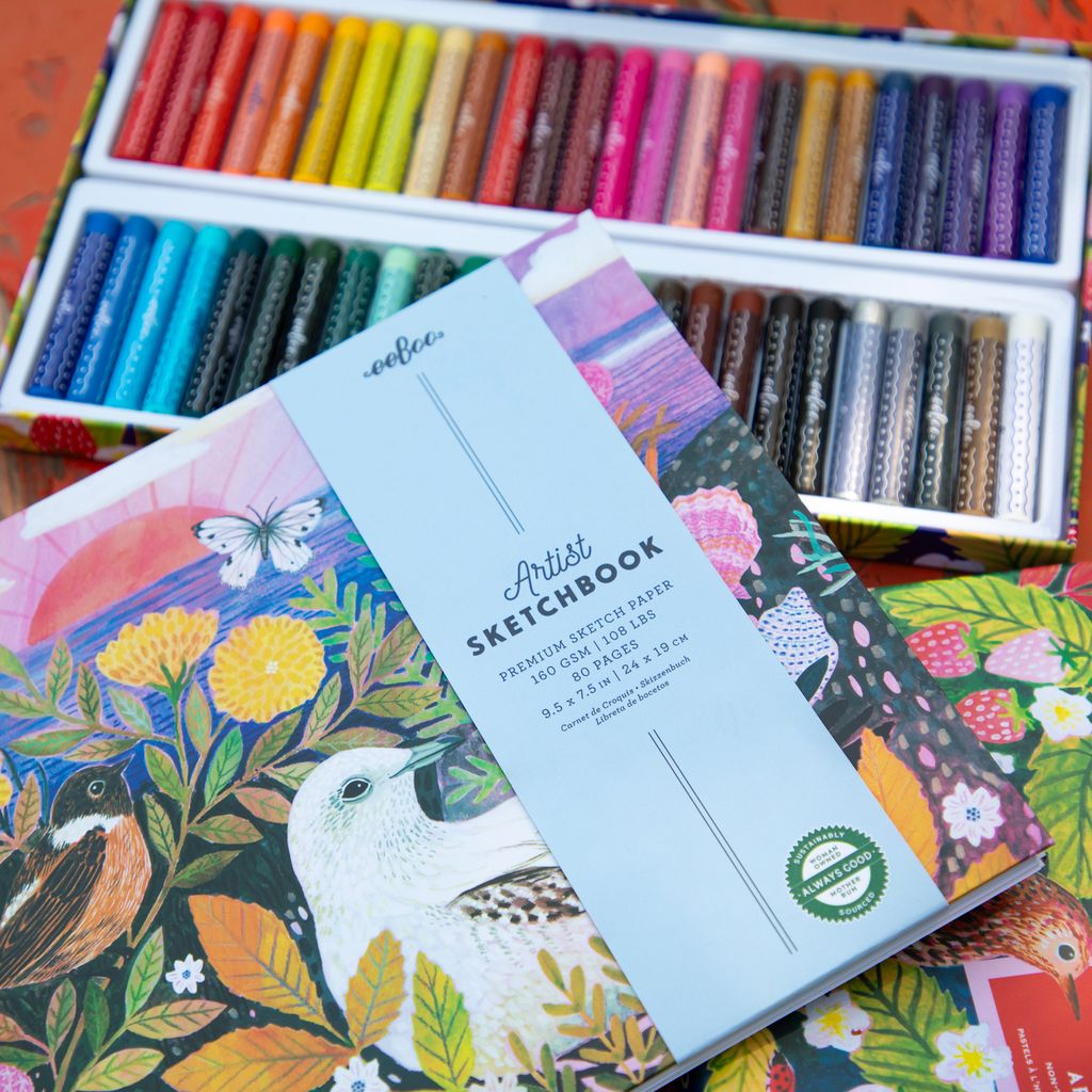 Artist sketchbook with colorful illustrations on a background of art supplies. Strawberry Peeps 50 Oil Pastels by eeBoo | Unique Beautiful Gifts