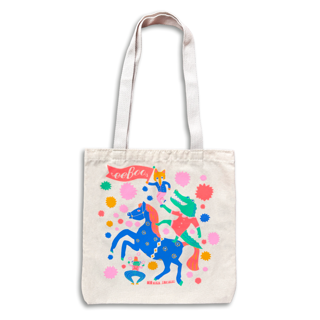Tote bag with colorful design of a person riding a unicorn on a white background