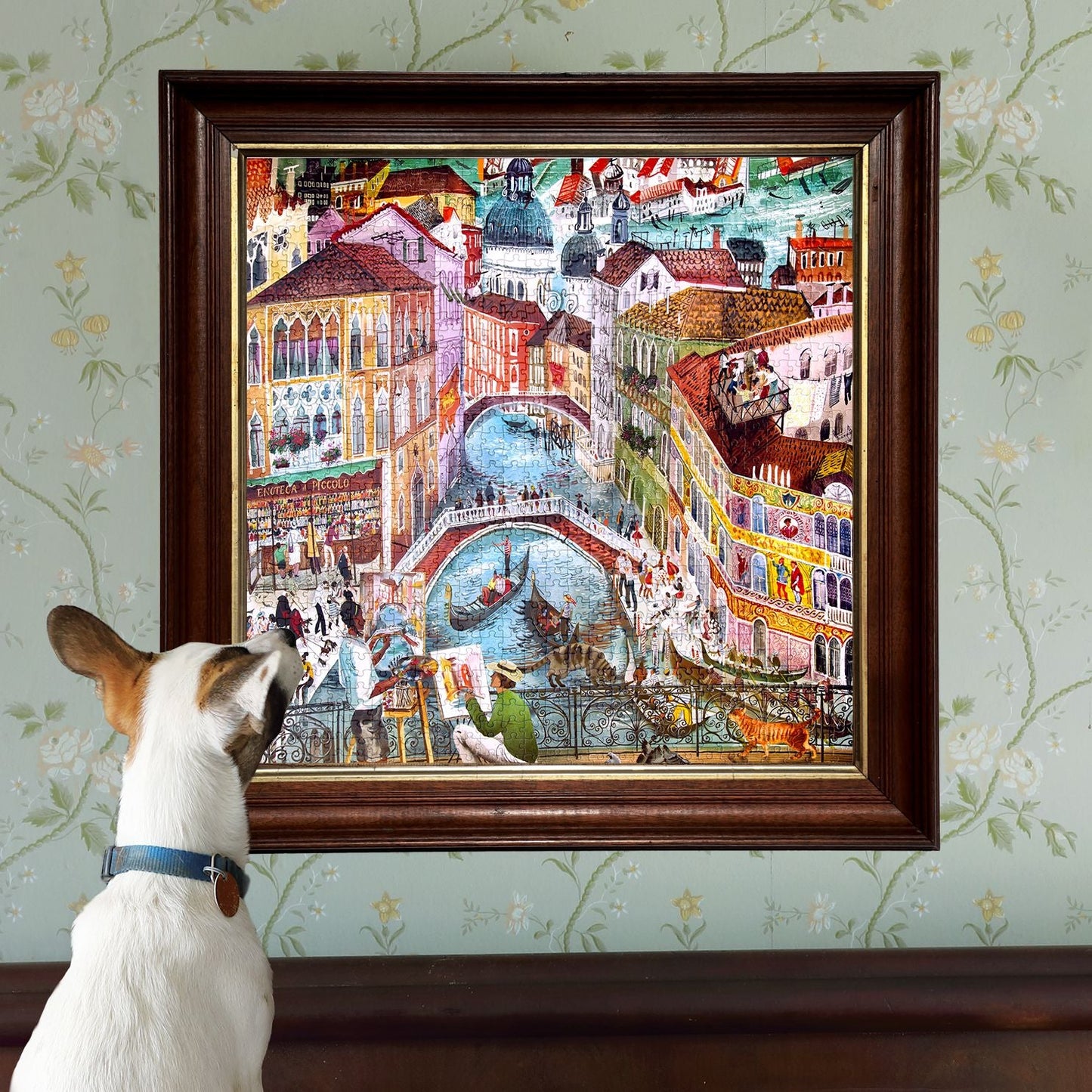 Dog looking at a colorful painting of a cityscape with a bridge on a wall. Artists in Venice Italy 1000 Piece Puzzle