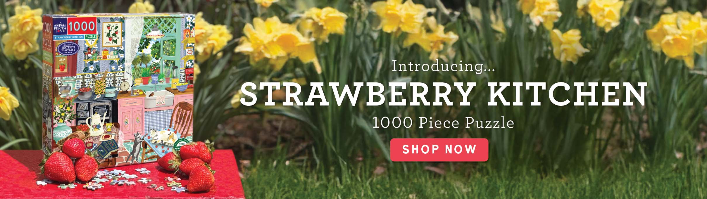 Strawberry Kitchen puzzle packaging with daffodils in the background. Text: Introducing Strawberry_Kitchen 1000 Piece Puzzle