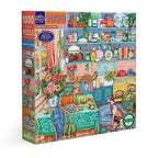 Jigsaw puzzle box featuring a colorful kitchen scene with  cat and a dog. Harvest Kitchen 1000 Piece Puzzle