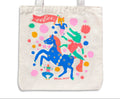 Tote bag with colorful design of a character riding a unicorn on a white background