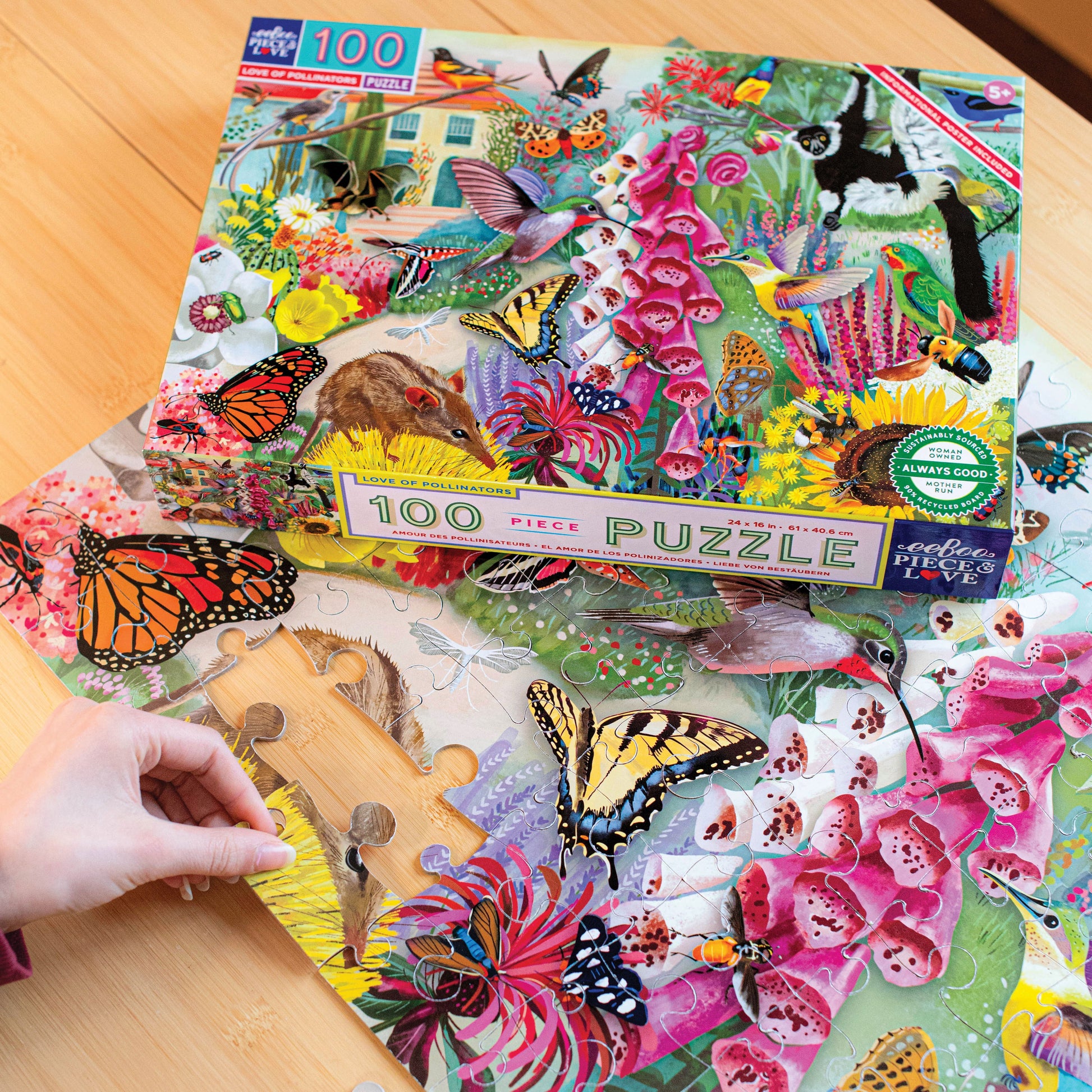 Jigsaw puzzle box featuring a colorful illustration of pollinators and flowers. 100 piece jigsaw puzzle by eeBoo
