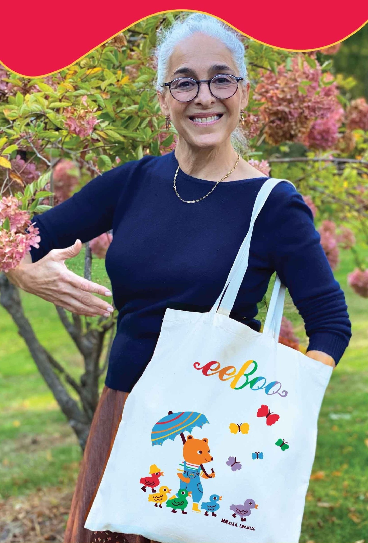 Mia holding Tote Bag with Bear and rainbow ducks