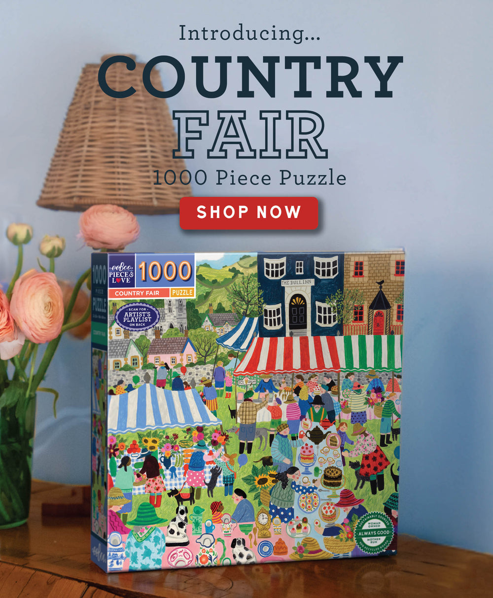 Jigsaw puzzle box titled 'Country Fair' with a colorful illustration of a market scene.