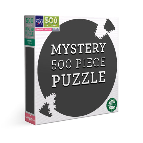 Box of a mystery 500 piece puzzle with a black circle and puzzle pieces 