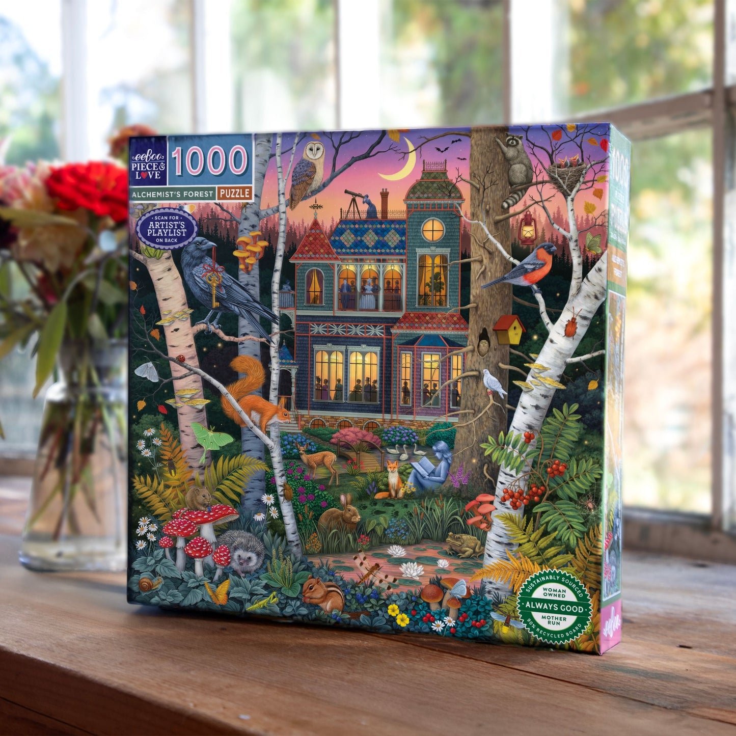 Jigsaw puzzle box with a forest scene design featuring animals and a house. Alchemist's Forest 1000 Piece Puzzle