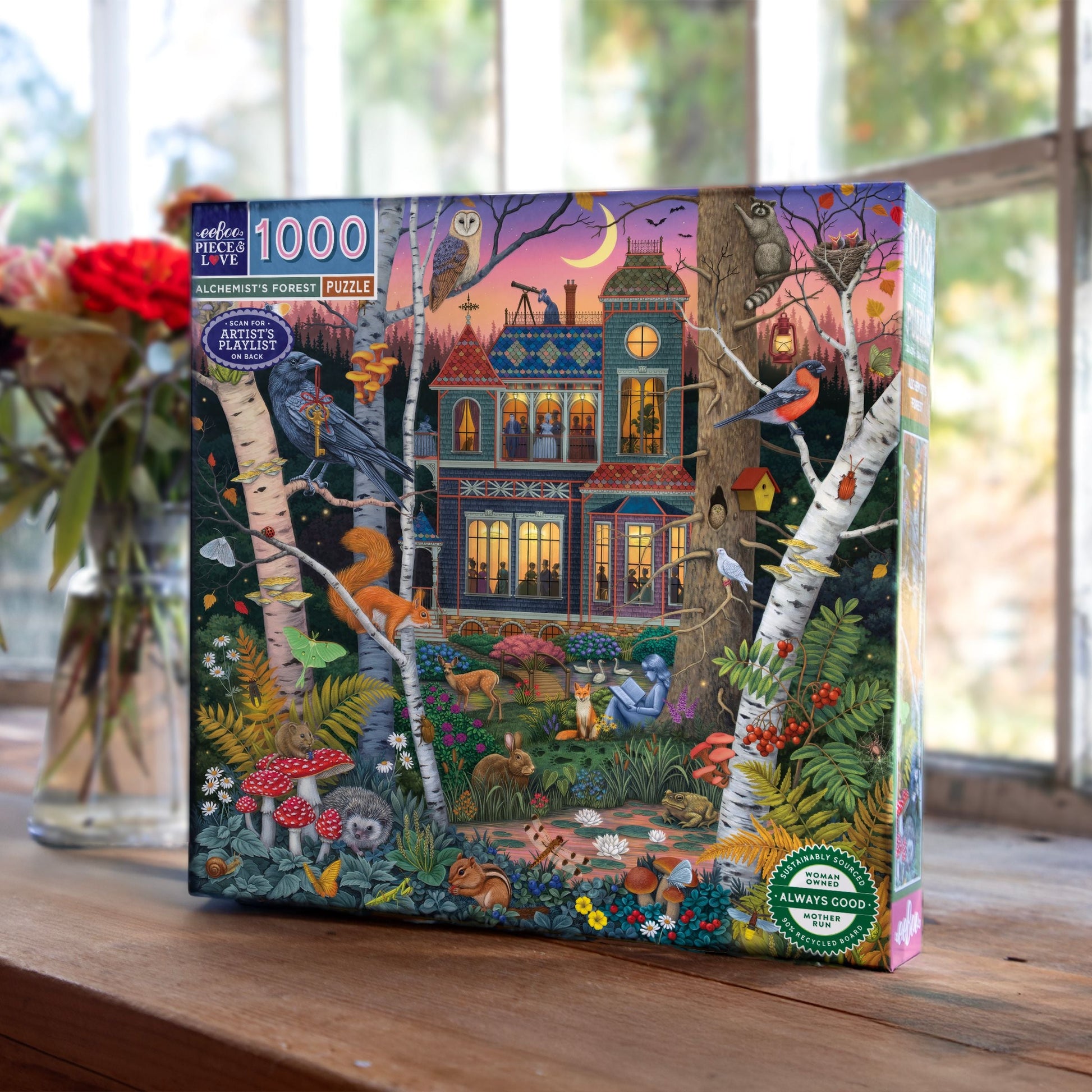 Jigsaw puzzle box with a forest scene design featuring animals and a house. Alchemist's Forest 1000 Piece Puzzle