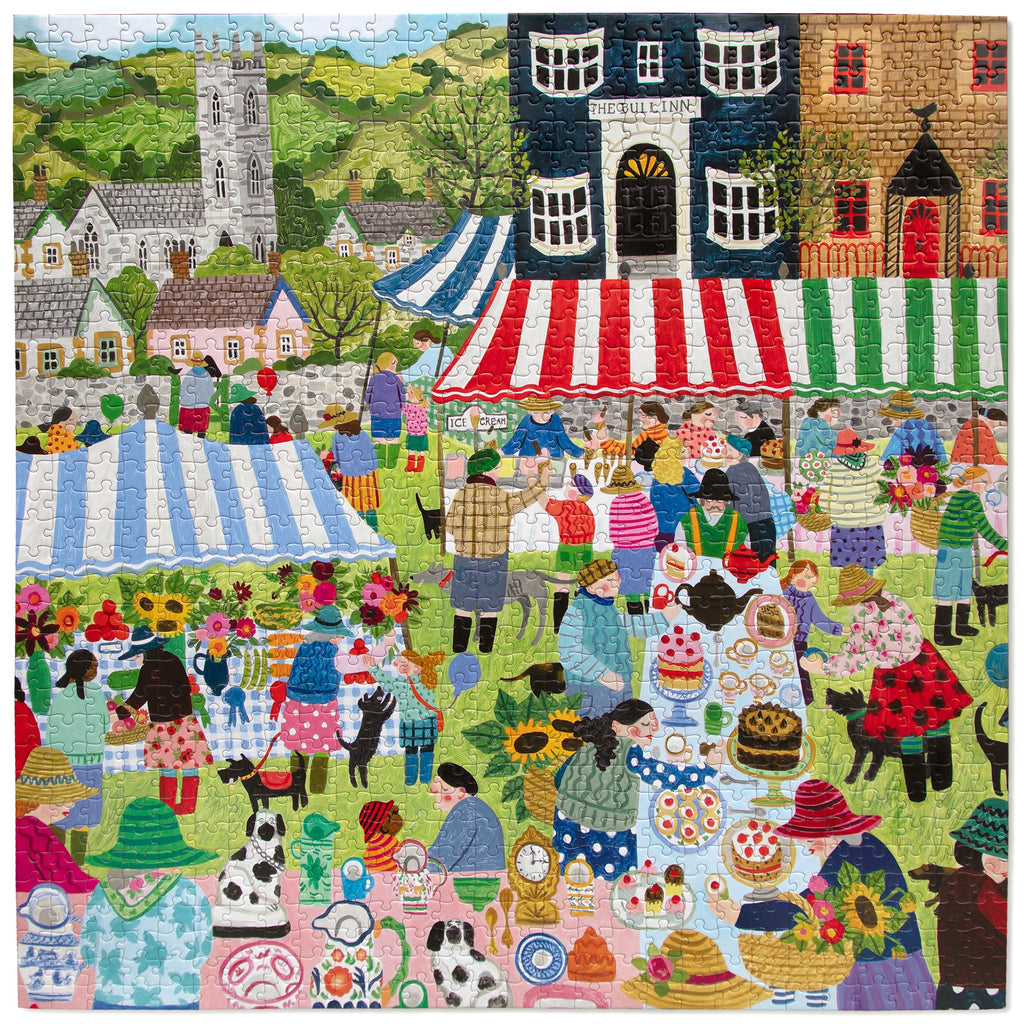 Artist Vanessa Bowman depicts a festive village square filled with tents, crafts & a colorful crowd gathering for the country fair. 1000 Piece Jigsaw Puzzle by eeBoo 