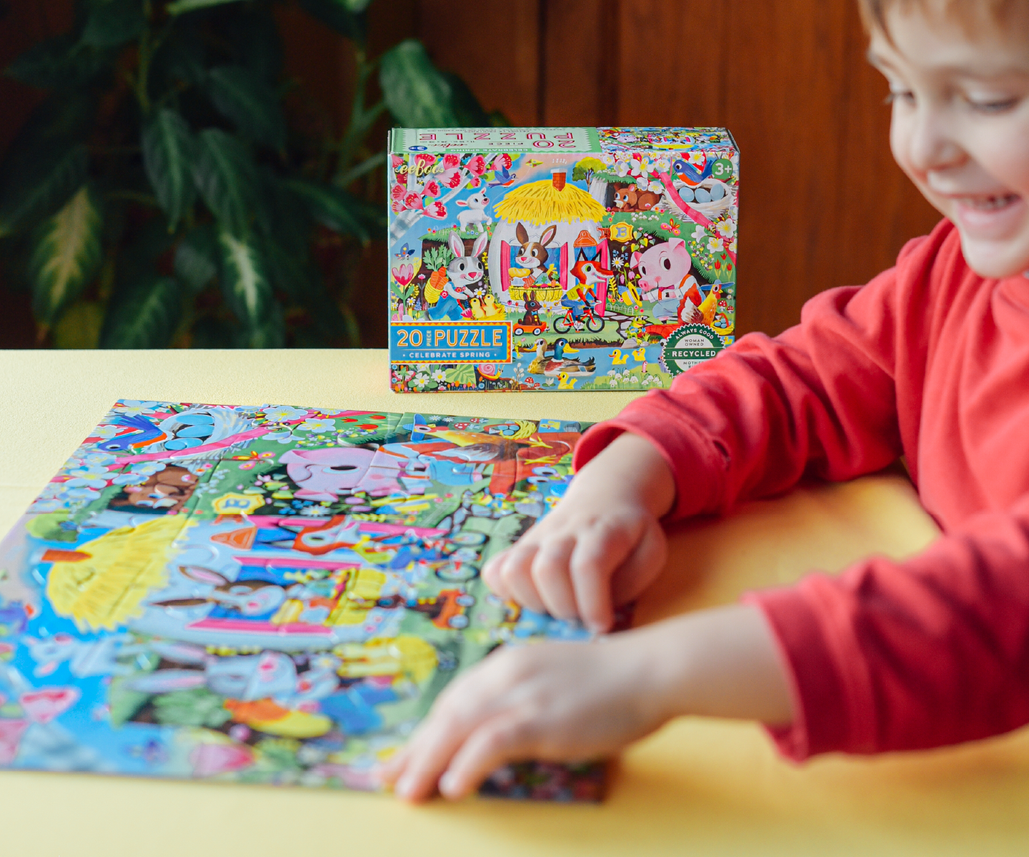 Child playing with Celebrate Spring 20 piece puzzle