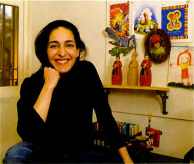 Mia in front of early eeBoo illustrations 