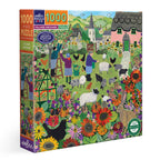 Village Orchard puzzle box with colorful illustration of a village scene. Village Orchard 1000 Piece Puzzle by eeBoo | Unique Beautiful Gifts