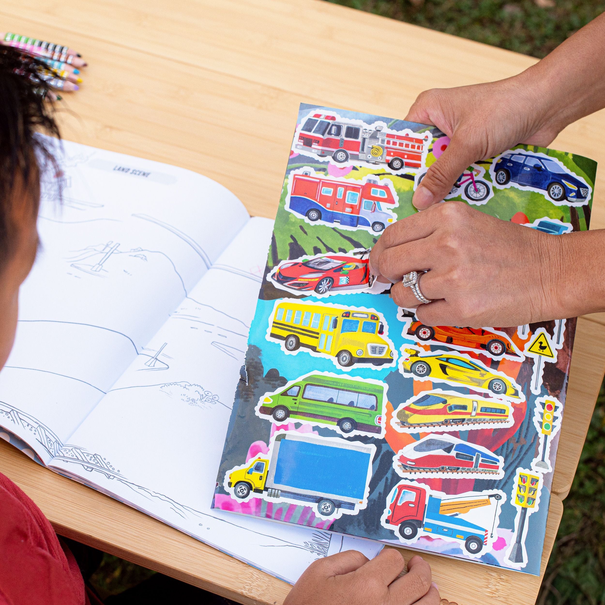 Coloring book titled 'Vehicles' with illustrations of a bulldozer, airplane, and other vehicles. Vehicles Fold-Out Coloring Book