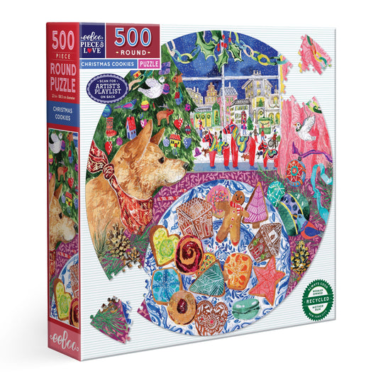Round puzzle box with a colorful design of a dog looking at Christmas cookies through a window. Christmas Cookies 500 Round Puzzle by eeBoo | Unique Beautiful Gifts