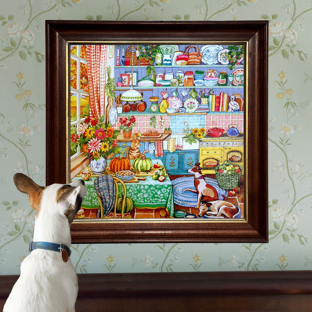 Jigsaw puzzle box featuring a colorful kitchen scene with  cat and a dog. Harvest Kitchen 1000 Piece Puzzle
