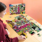 Jigsaw puzzle box featuring a colorful illustration of pollinators and flowers. 100 piece jigsaw puzzle by eeBoo